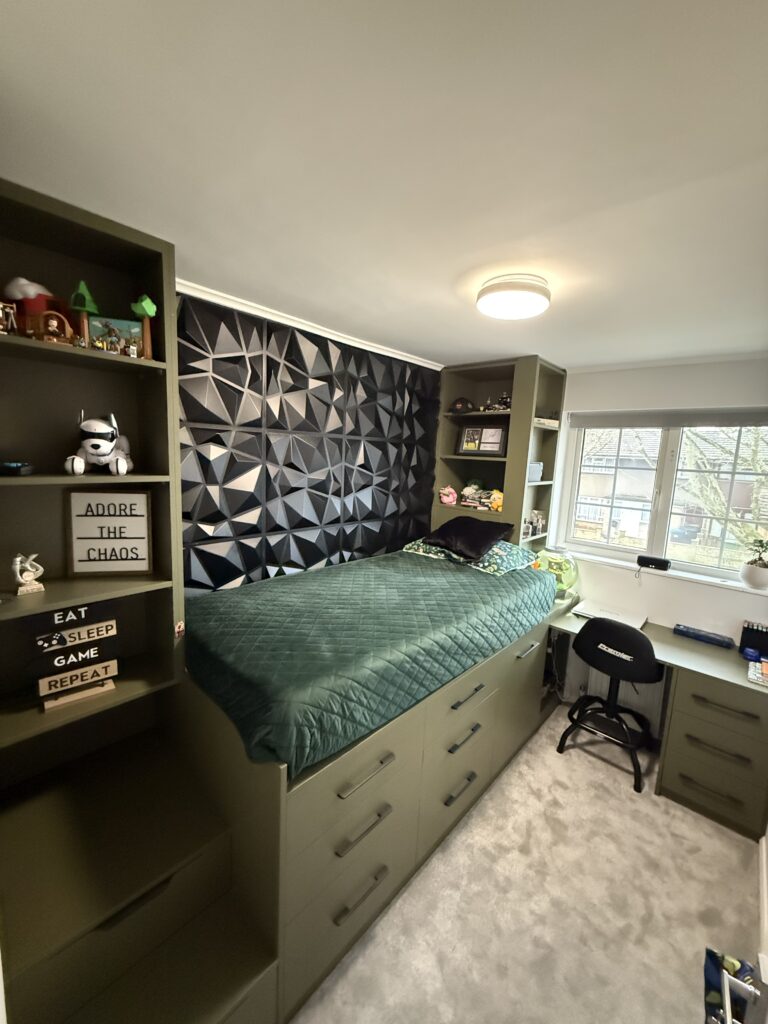 Completed bespoke bedroom with integrated bed, drawers, shelving and desk
