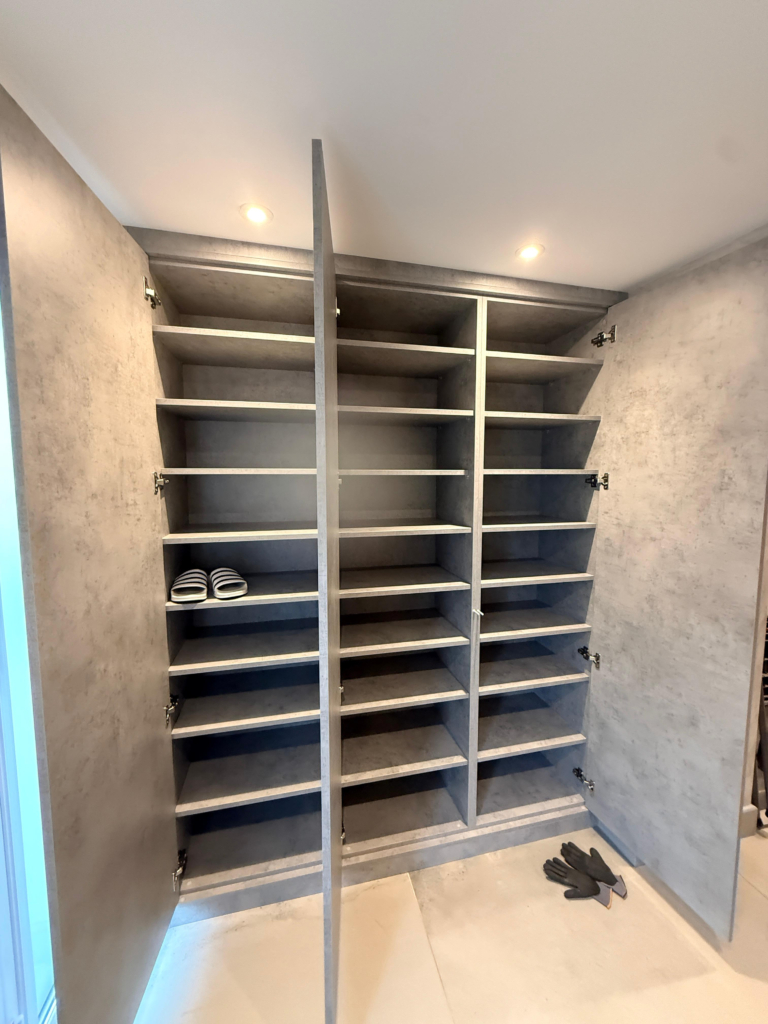 Bespoke hallway shoe storage unit with integrated mirror, made-to-measure fitted furniture installation in Hertfordshire by Furnitureistic