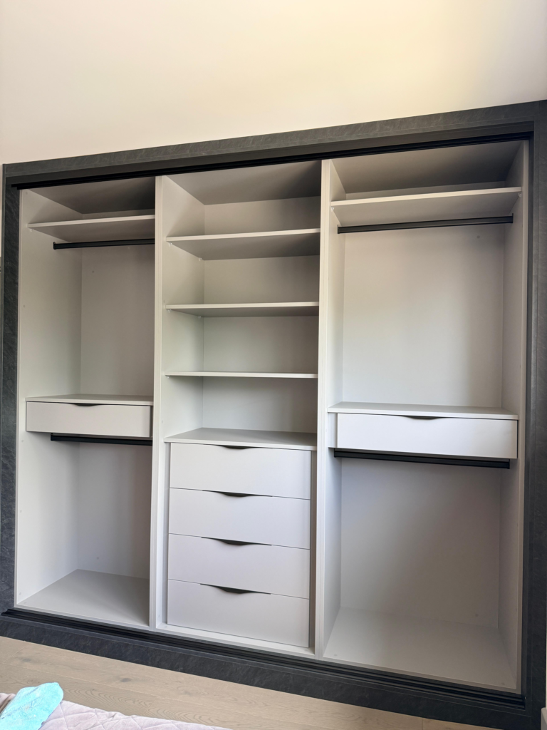 Three bespoke sliding wardrobes transformed the bedrooms into organised, contemporary spaces.