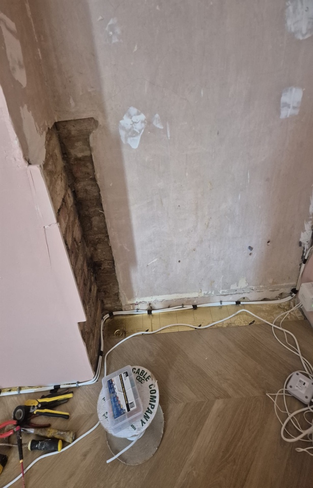 Bedroom wall preparation before installing a made-to-measure floor-to-ceiling wardrobe with integrated storage