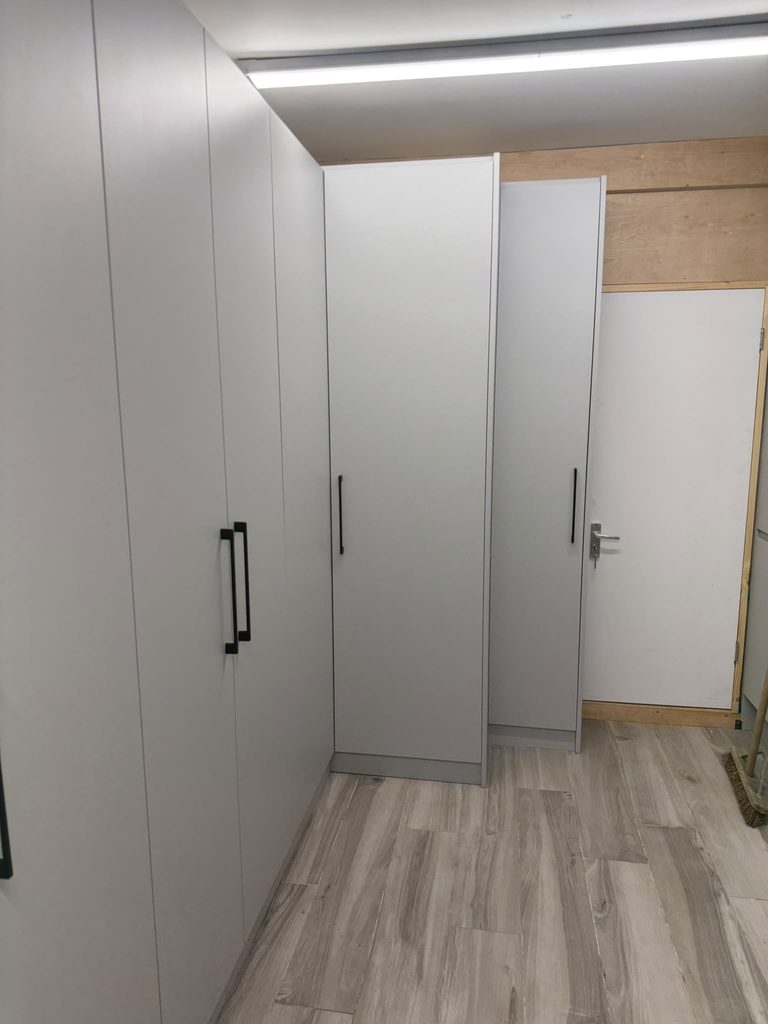 Bespoke garage storage cabinet with adjustable internal shelving designed for practical everyday organisation